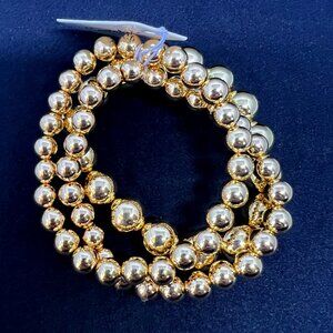 Fun, Fashionable five strand gold tone stretchy bracelet